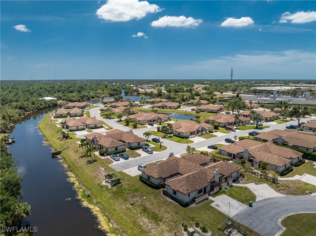 13100 South McCall Road, Unit 112 Port Charlotte, FL 33981 - Photo 39 of 45 an aerial view of residential houses with outdoor space