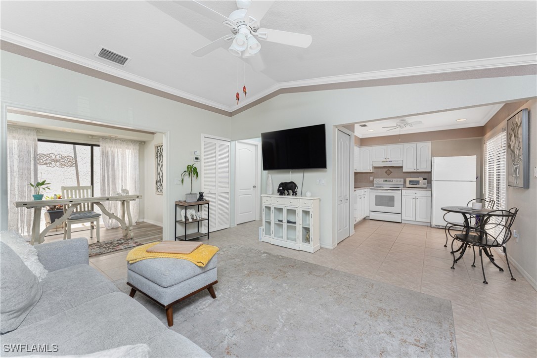 13100 South McCall Road, Unit 112 Port Charlotte, FL 33981 - Photo 6 of 45 a living room with furniture and a flat screen tv
