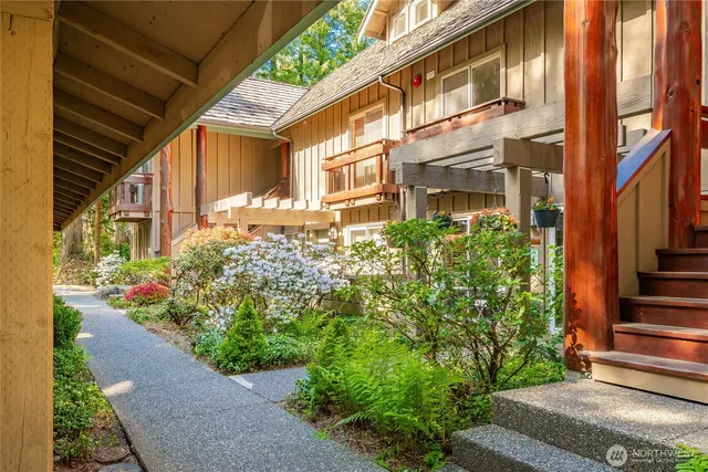 a view of a pathway both side of the house