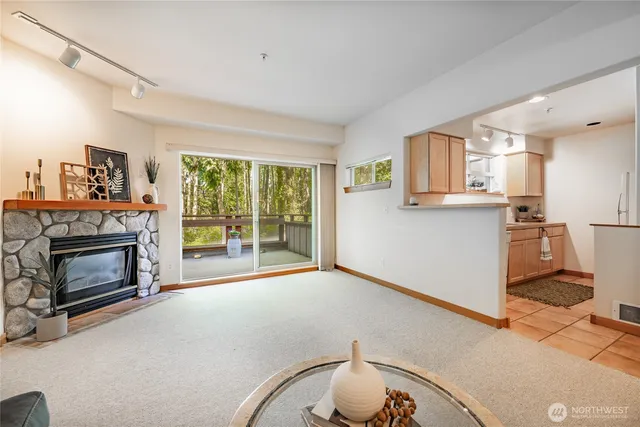 a living room with furniture a window and a table