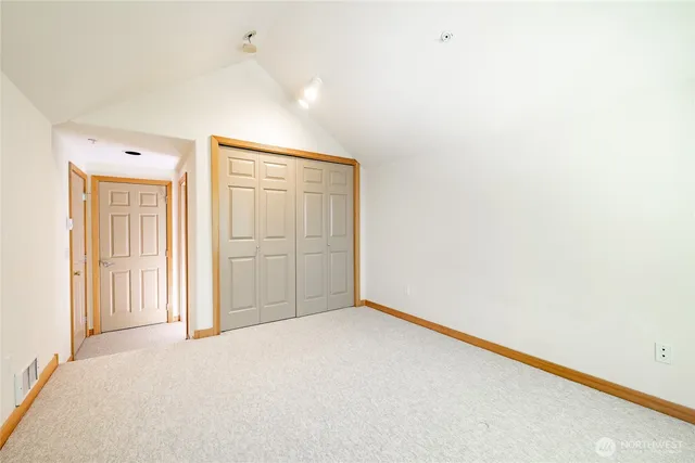 a bathroom with a sink mirror vanity and toilet