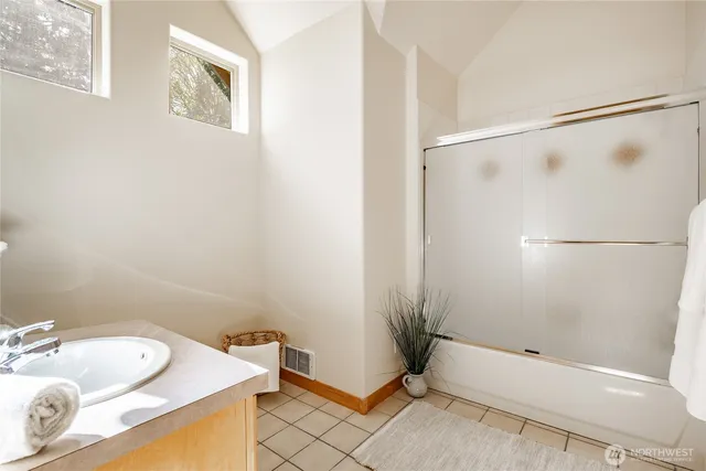 a view of a large building with a big yard and large trees