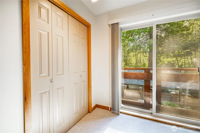a view of a room with sliding door and wooden floor