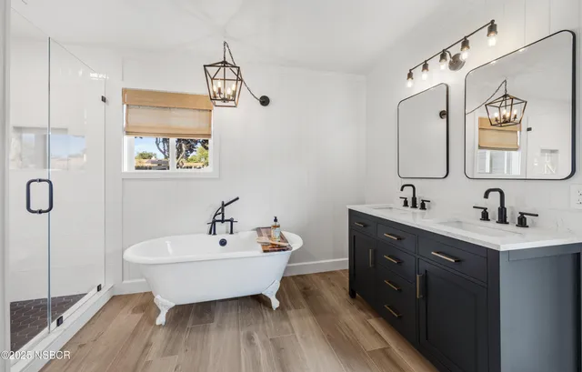 a spacious bathroom with a double vanity sink and a mirror