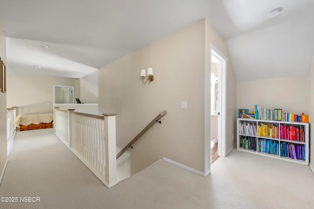a view of hallway with furniture and toys