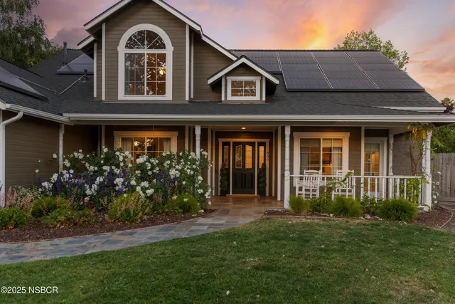 a front view of a house with garden