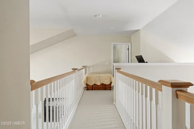 a view of a bedroom from a hallway