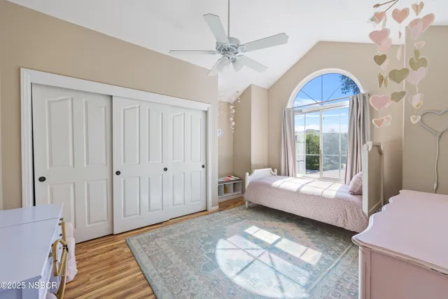 a living room with a bed furniture and a window