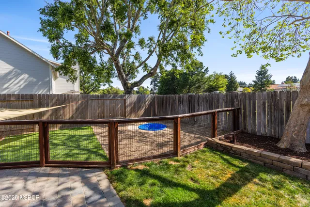 a backyard of a house with lots of green space