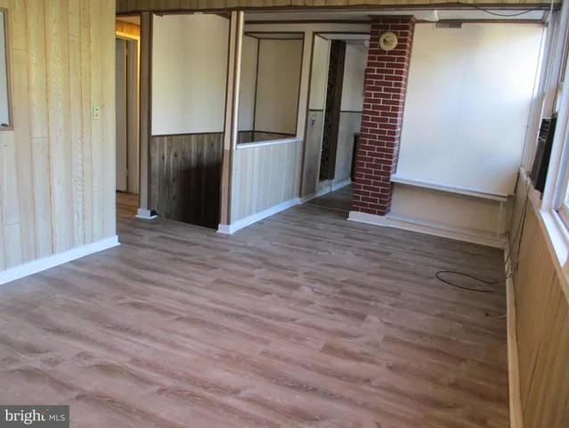 a kitchen with granite countertop cabinets stainless steel appliances and a counter space