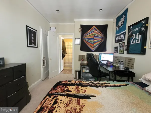 a room with furniture and painting on the wall