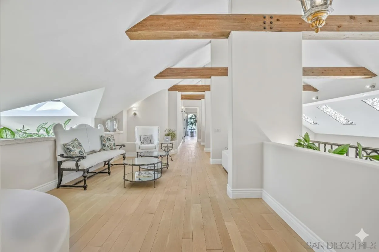 5305 La Crescenta Road Rancho Santa Fe, CA 92067 - Photo 39 of 64 Upstairs hall with sitting areas feature wide plank oak floors and beautiful wood beams .