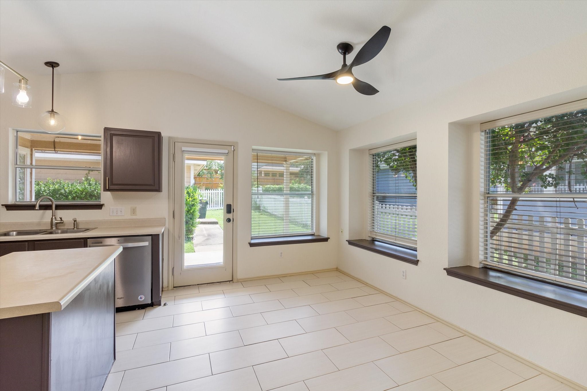 4500 Mather Kyle, TX 78640 - Photo 4 of 14 a large kitchen with a large window and stainless steel appliances