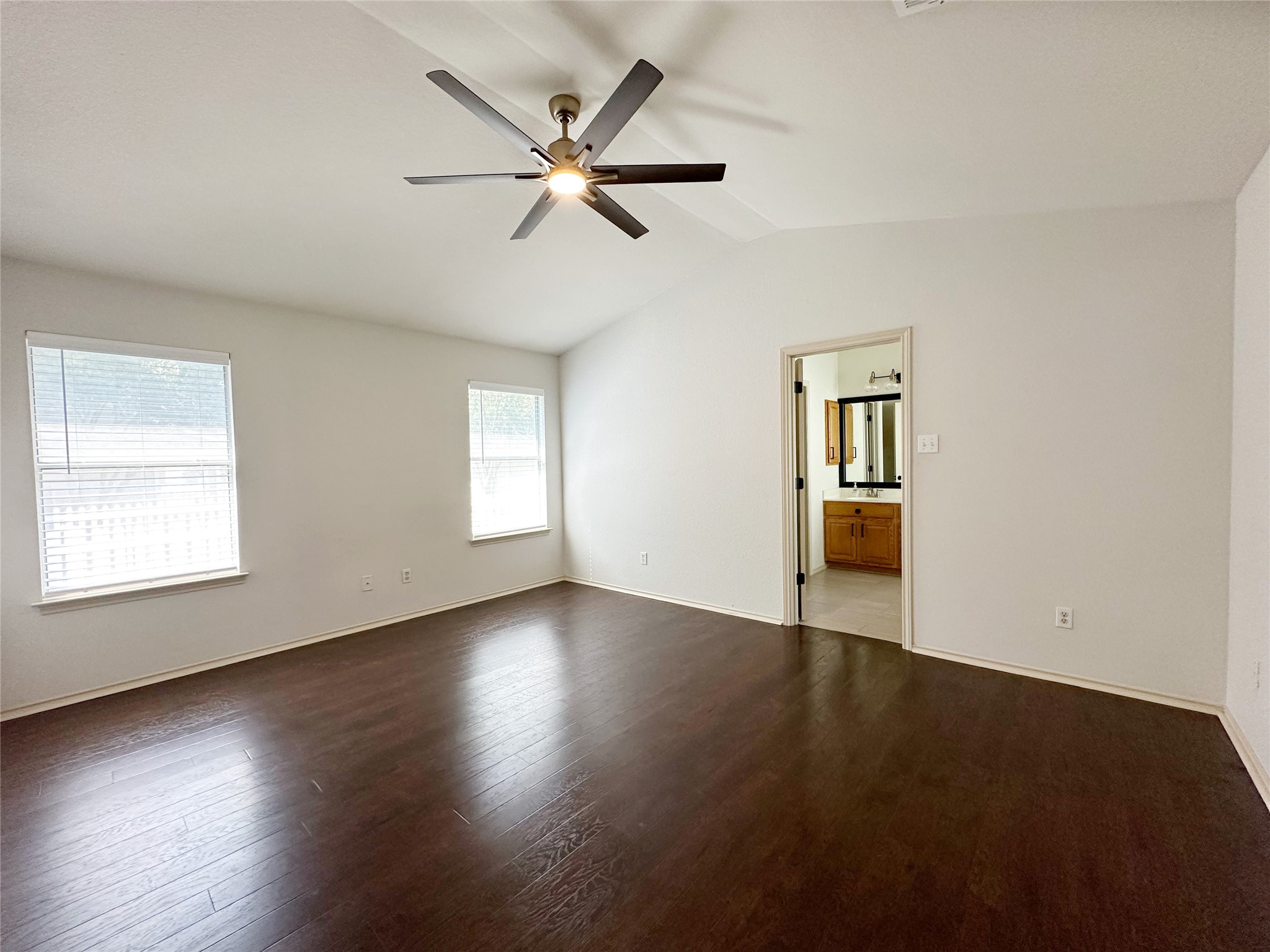 4500 Mather Kyle, TX 78640 - Photo 5 of 14 a view of an empty room with a window and wooden floor
