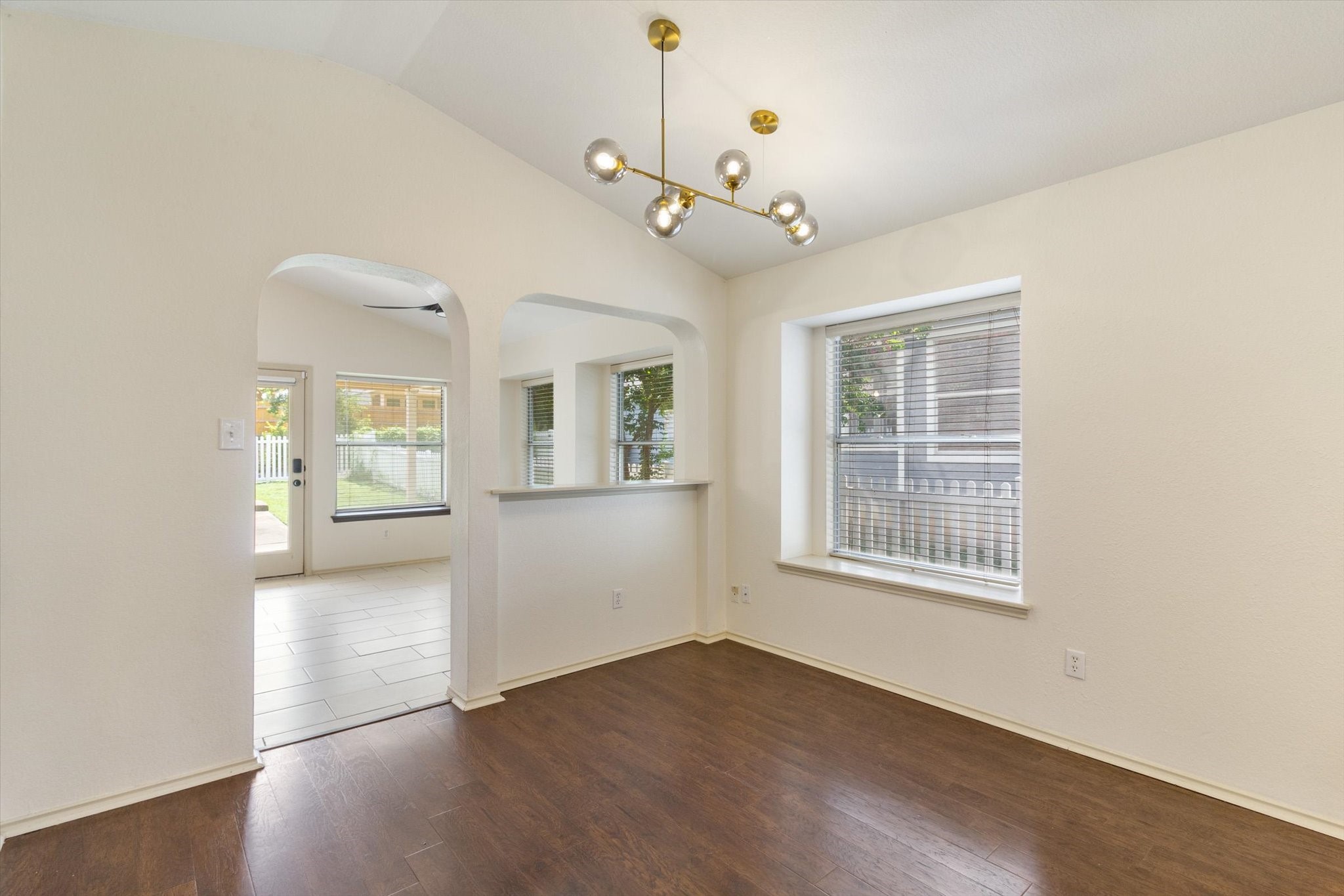 4500 Mather Kyle, TX 78640 - Photo 7 of 14 a view of an empty room with a window and wooden floor