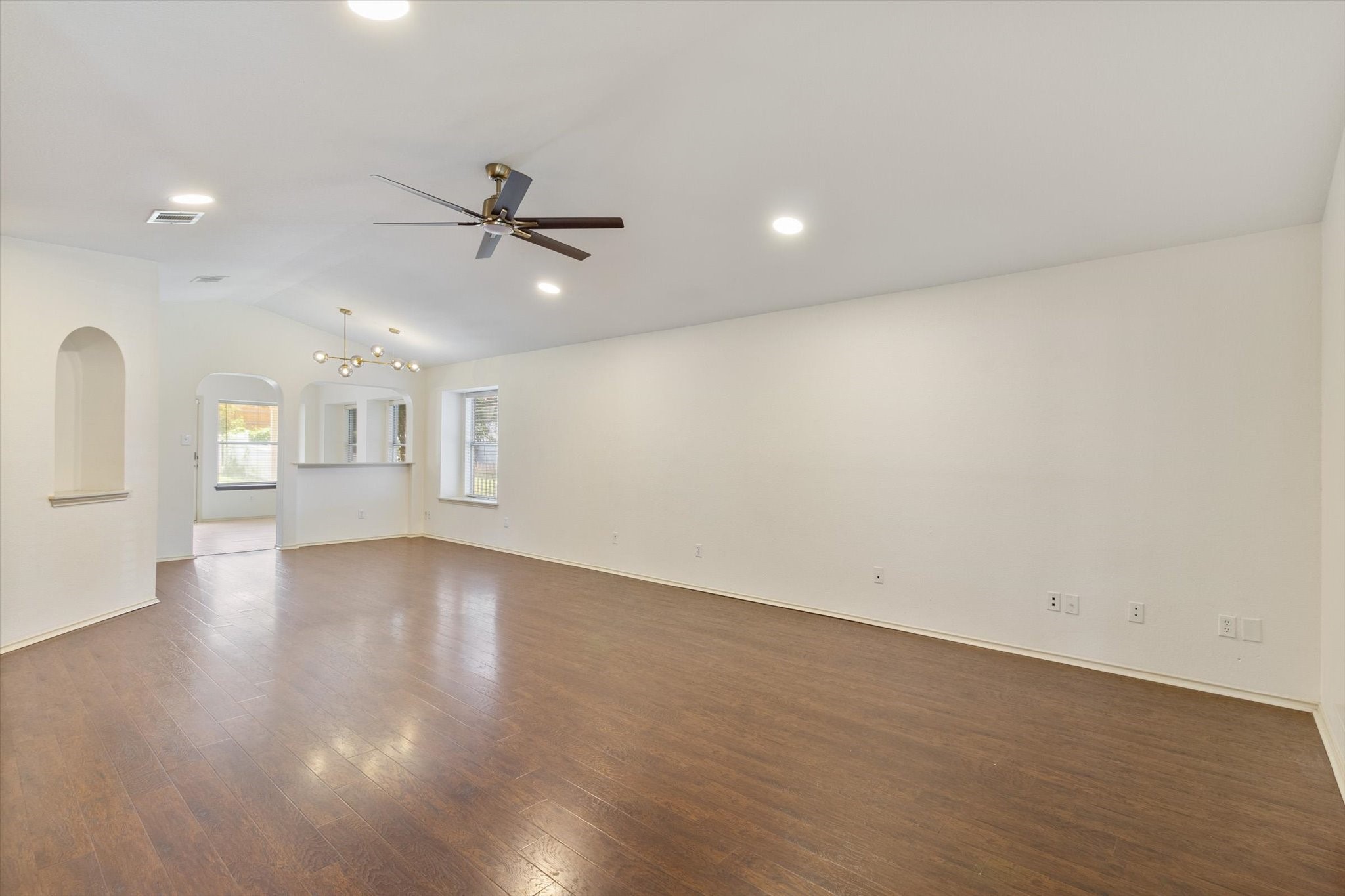 4500 Mather Kyle, TX 78640 - Photo 10 of 14 an empty room with wooden floor and windows