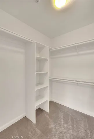 a view of an empty walk in closet
