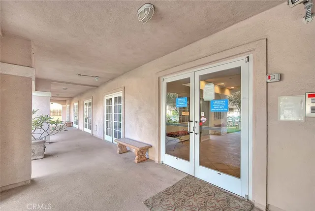 a view of a livingroom with wooden floor and windows