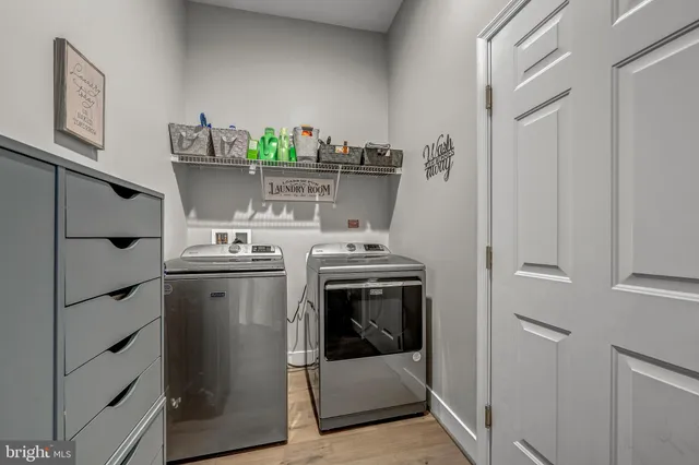 a kitchen with stainless steel appliances granite countertop a refrigerator and a stove