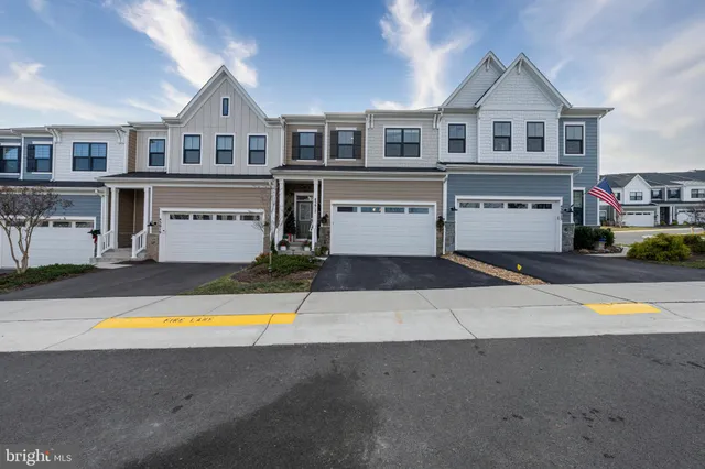 a view of a house with a swimming pool and a yard