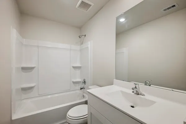 a bathroom with a sink toilet and bathtub