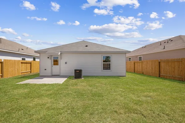 a view of a backyard with a garden and yard
