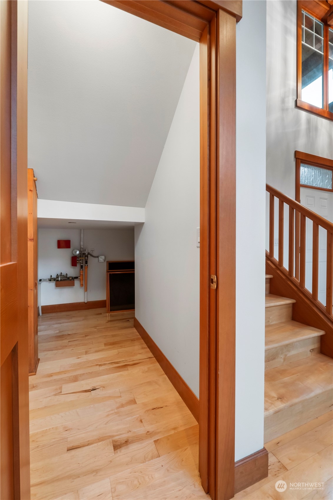 73 Raft Island Drive Northwest Gig Harbor, WA 98335 - Photo 16 of 40 a view of a hallway view of wooden floor and a living room