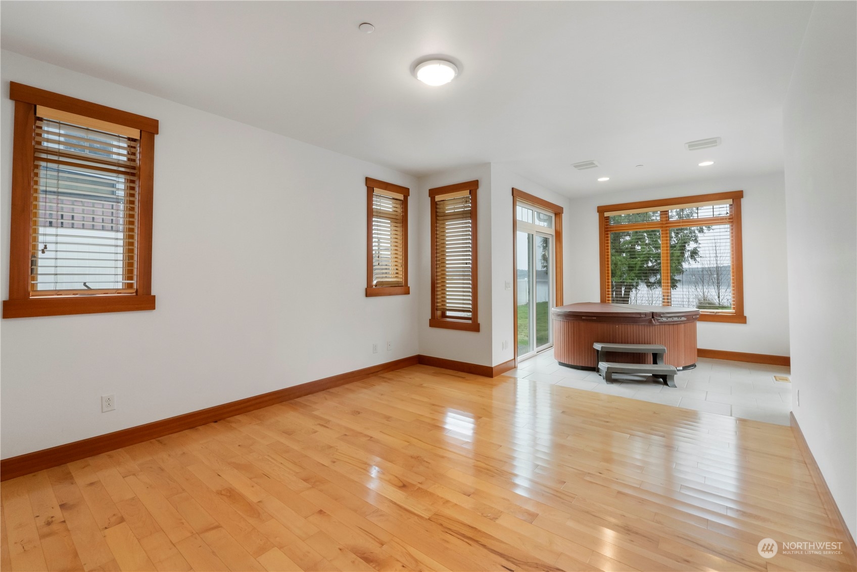 73 Raft Island Drive Northwest Gig Harbor, WA 98335 - Photo 19 of 40 wooden floor in an empty room with a window