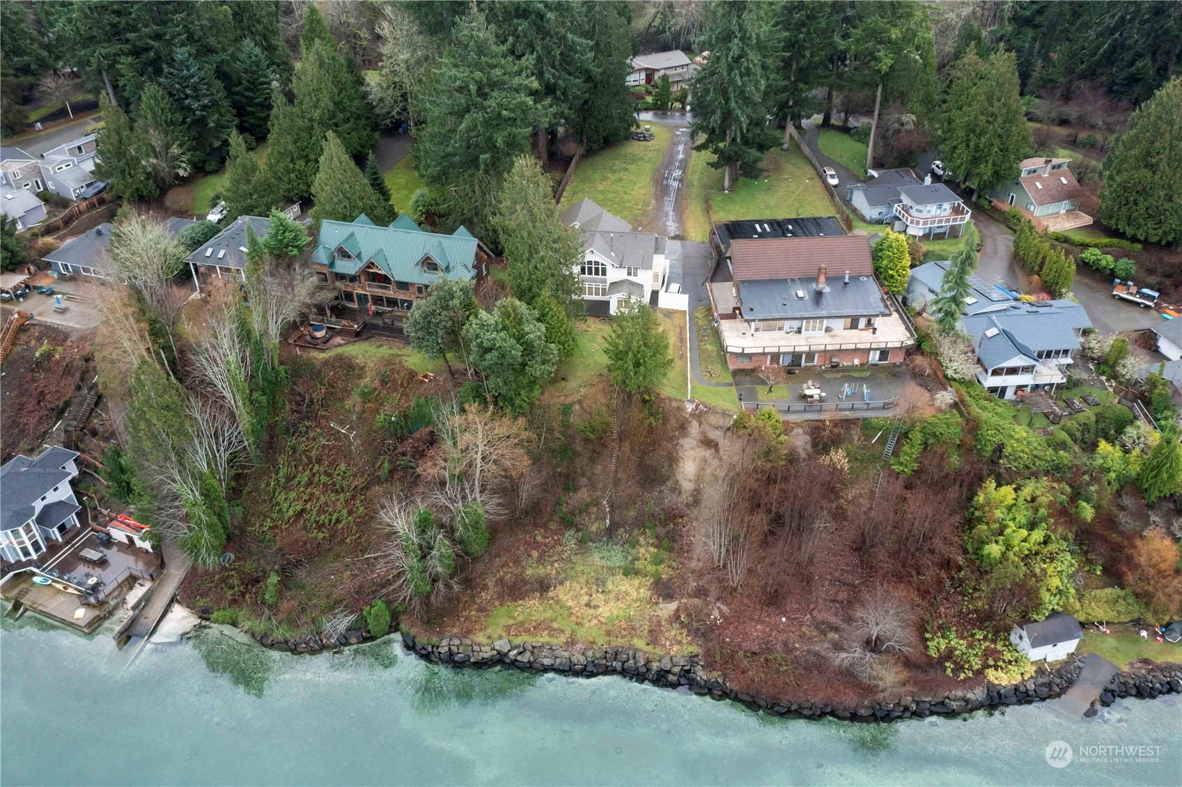 73 Raft Island Drive Northwest Gig Harbor, WA 98335 - Photo 2 of 40 an aerial view of a house with a yard and lake