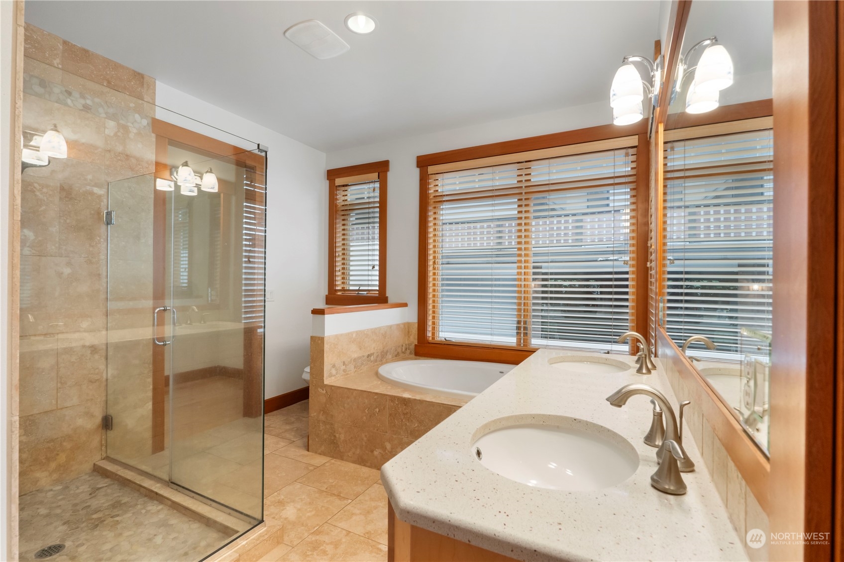 73 Raft Island Drive Northwest Gig Harbor, WA 98335 - Photo 21 of 40 a bathroom with a tub and a sink