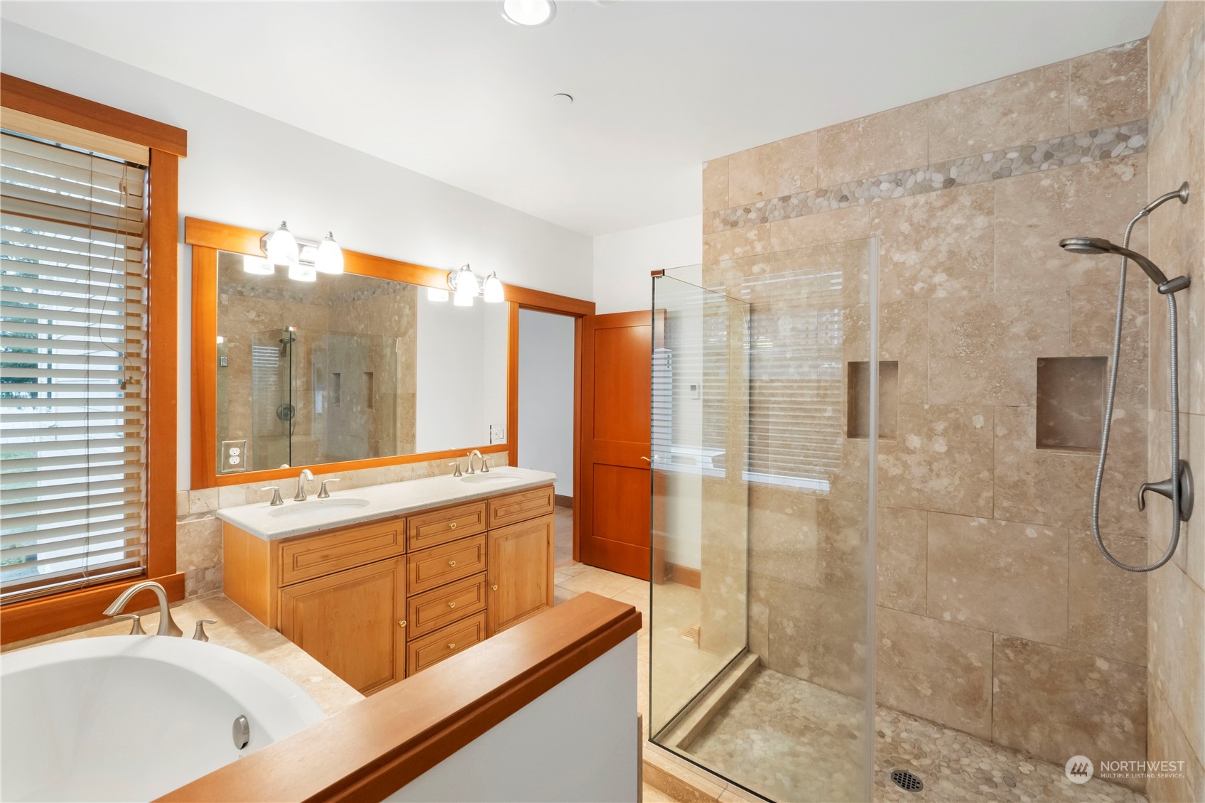 73 Raft Island Drive Northwest Gig Harbor, WA 98335 - Photo 23 of 40 a bathroom with a tub sink shower and mirror