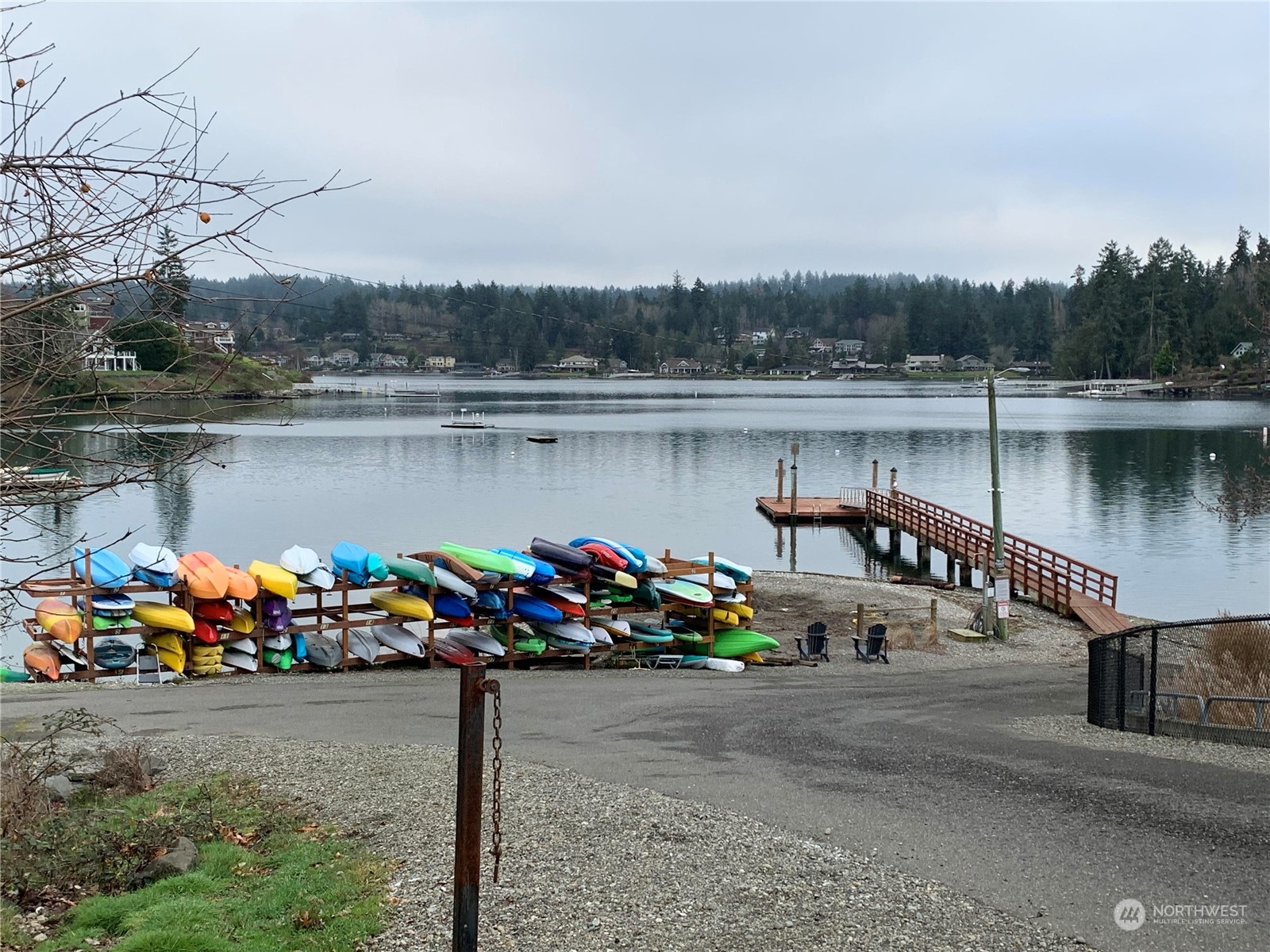 73 Raft Island Drive Northwest Gig Harbor, WA 98335 - Photo 37 of 40 a view of a lake with a bench in the river