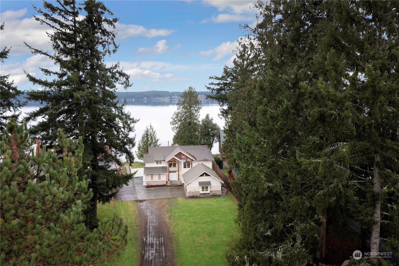 73 Raft Island Drive Northwest Gig Harbor, WA 98335 - Photo 5 of 40 a view of a house with a yard