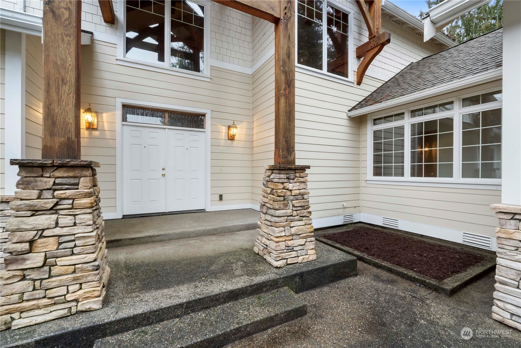 73 Raft Island Drive Northwest Gig Harbor, WA 98335 - Photo 6 of 40 a front view of a house with a yard