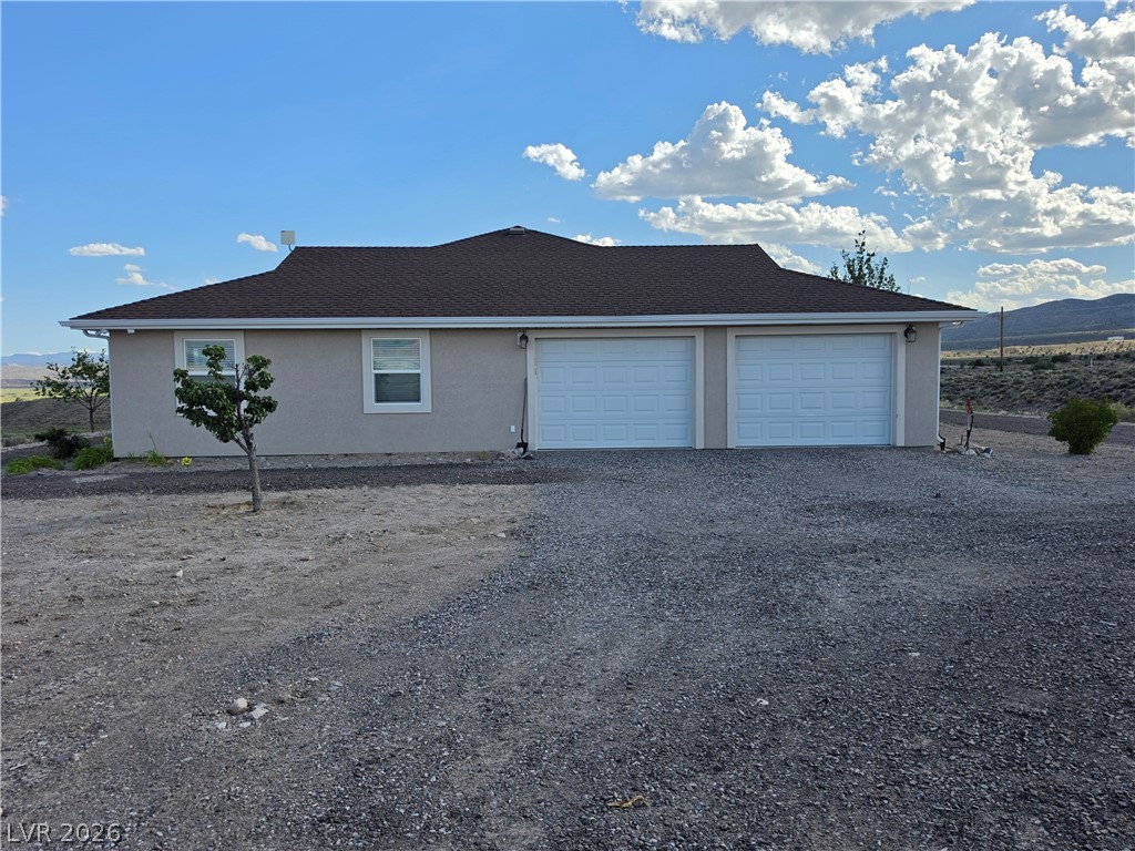 5272 Truman Lane Caliente, NV 89008 - Photo 41 of 43 A well-maintained stucco residence offers an attached garage and commanding desert vistas.