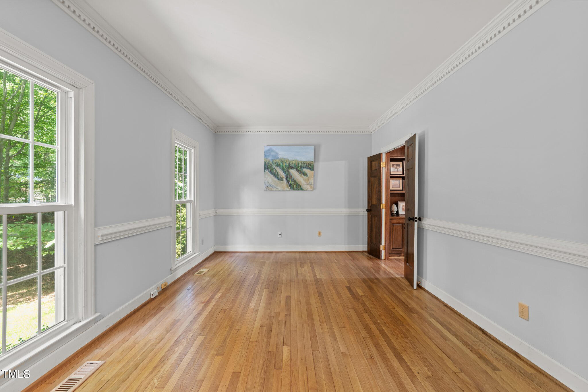 2840 Mattlyn Court Raleigh, NC 27613 - Photo 3 of 42 wooden floor in an empty room with a window