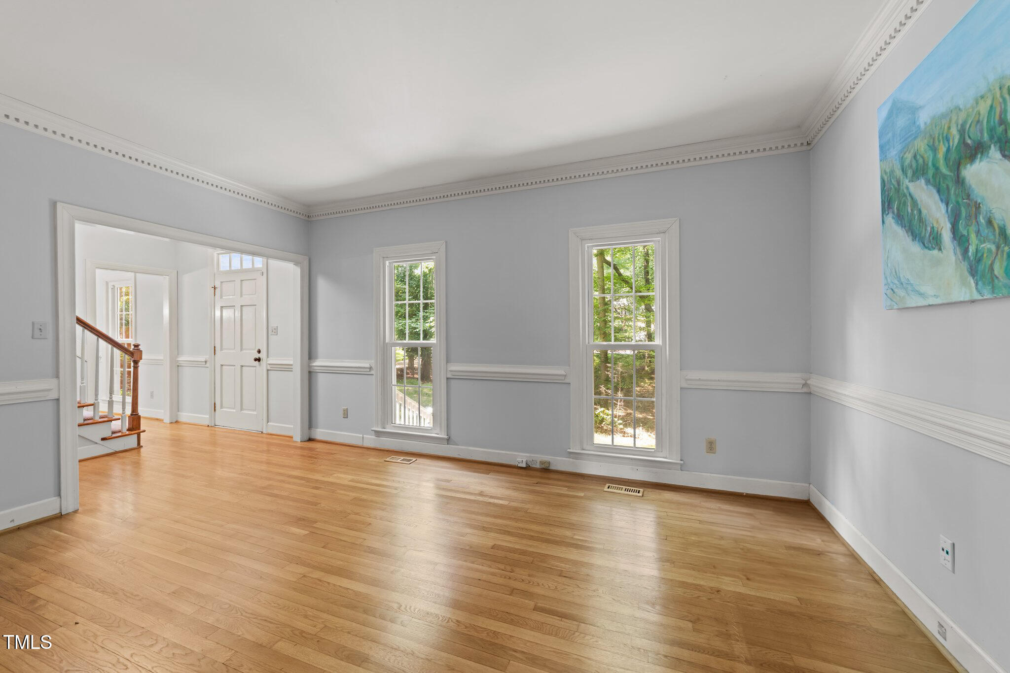 2840 Mattlyn Court Raleigh, NC 27613 - Photo 4 of 42 an empty room with wooden floor and windows