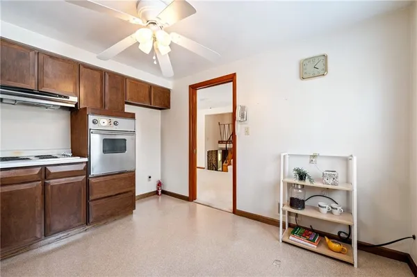 a bathroom with a sink toilet and a mirror