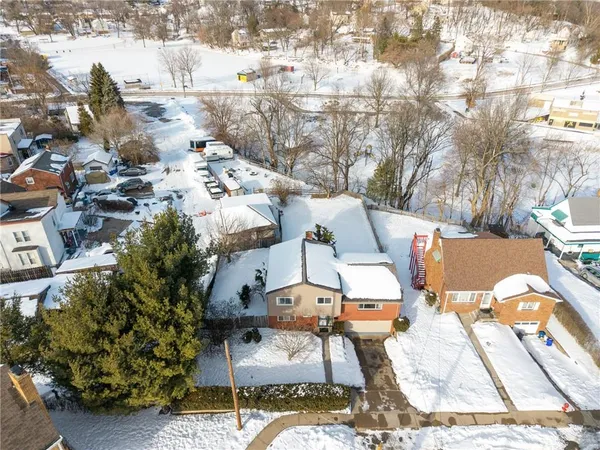 an aerial view of residential building and parking space