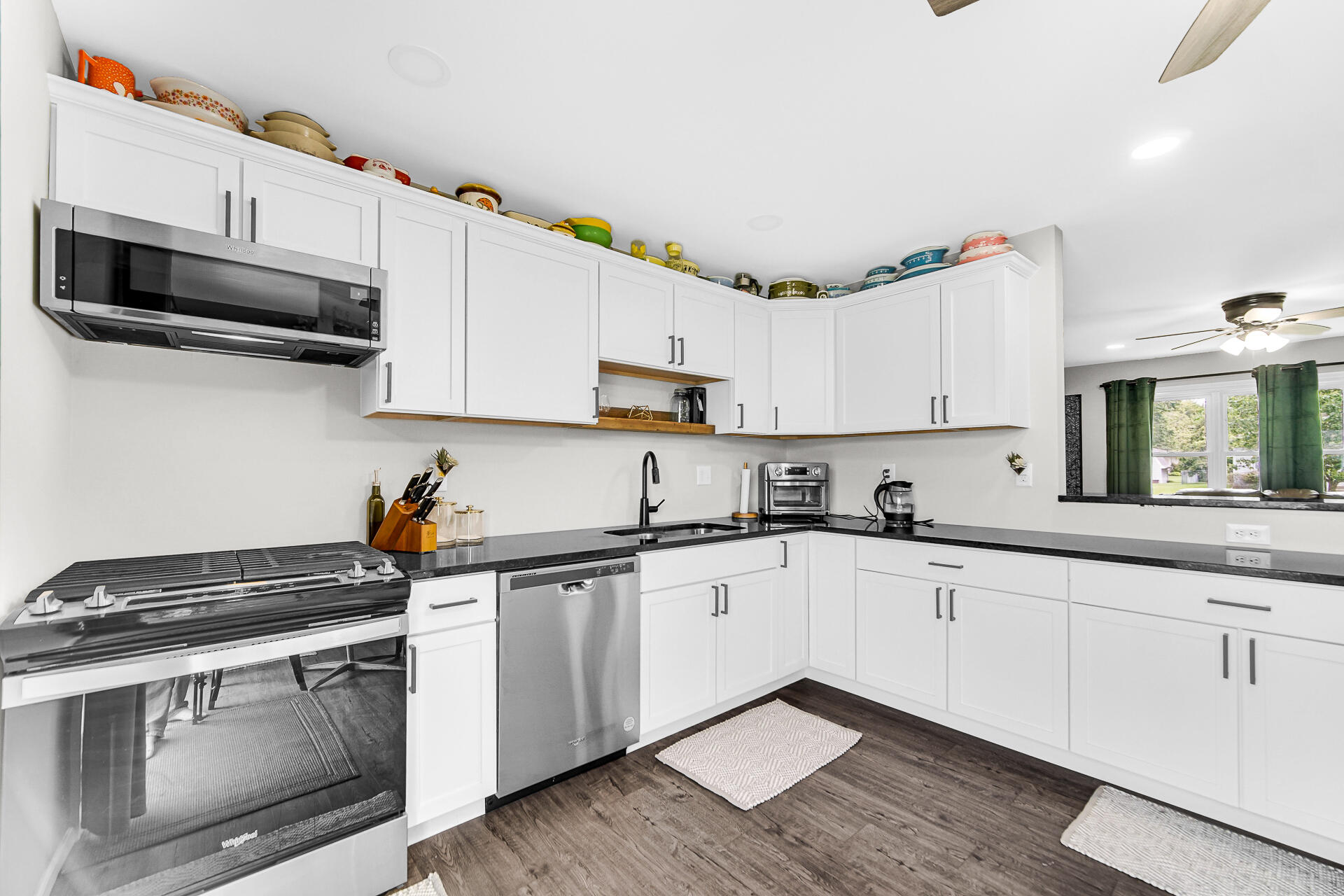 110 Beech Court Hebron, IN 46341 - Photo 11 of 18 a kitchen with cabinets stainless steel appliances a sink and a stove