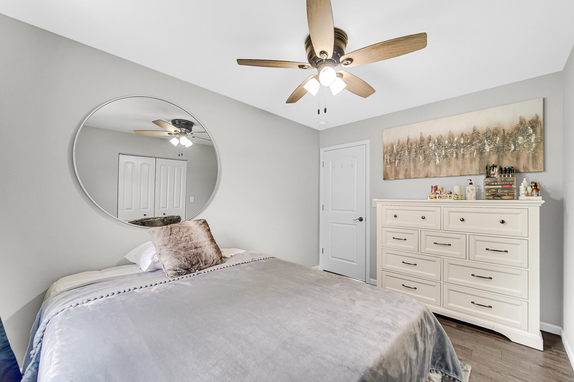 110 Beech Court Hebron, IN 46341 - Photo 12 of 18 a bedroom with a bed a window and a mirror on dresser