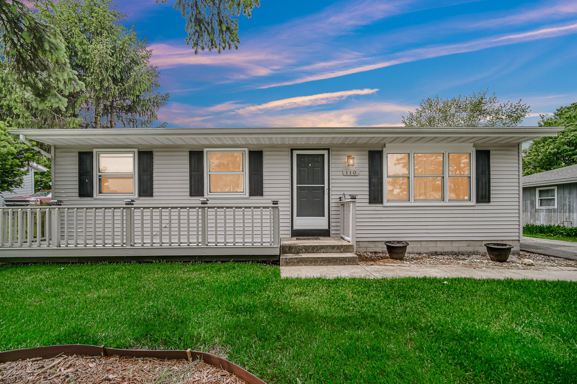 110 Beech Court Hebron, IN 46341 - Photo 18 of 18 a view of a house with a yard and sitting area