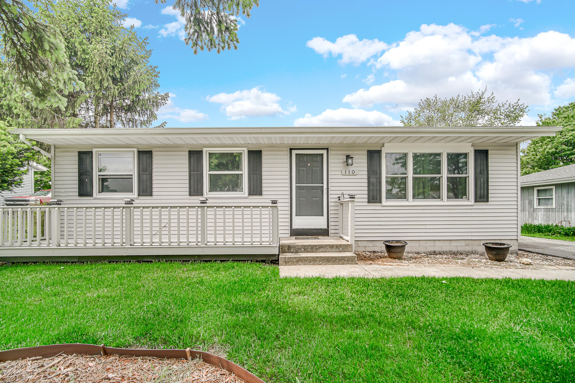 110 Beech Court Hebron, IN 46341 - Photo 3 of 18 a view of a house with a yard and sitting area