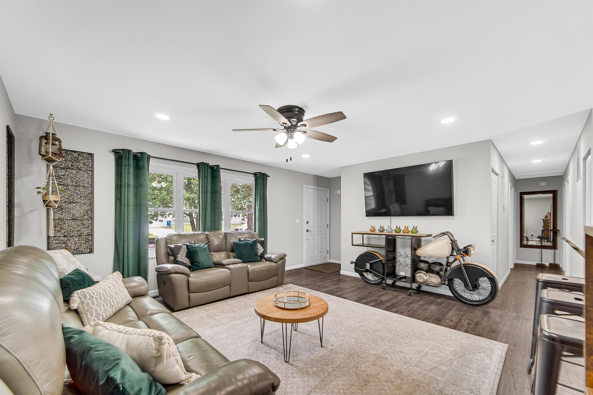 110 Beech Court Hebron, IN 46341 - Photo 4 of 18 a living room with furniture a flat screen tv and a view of kitchen