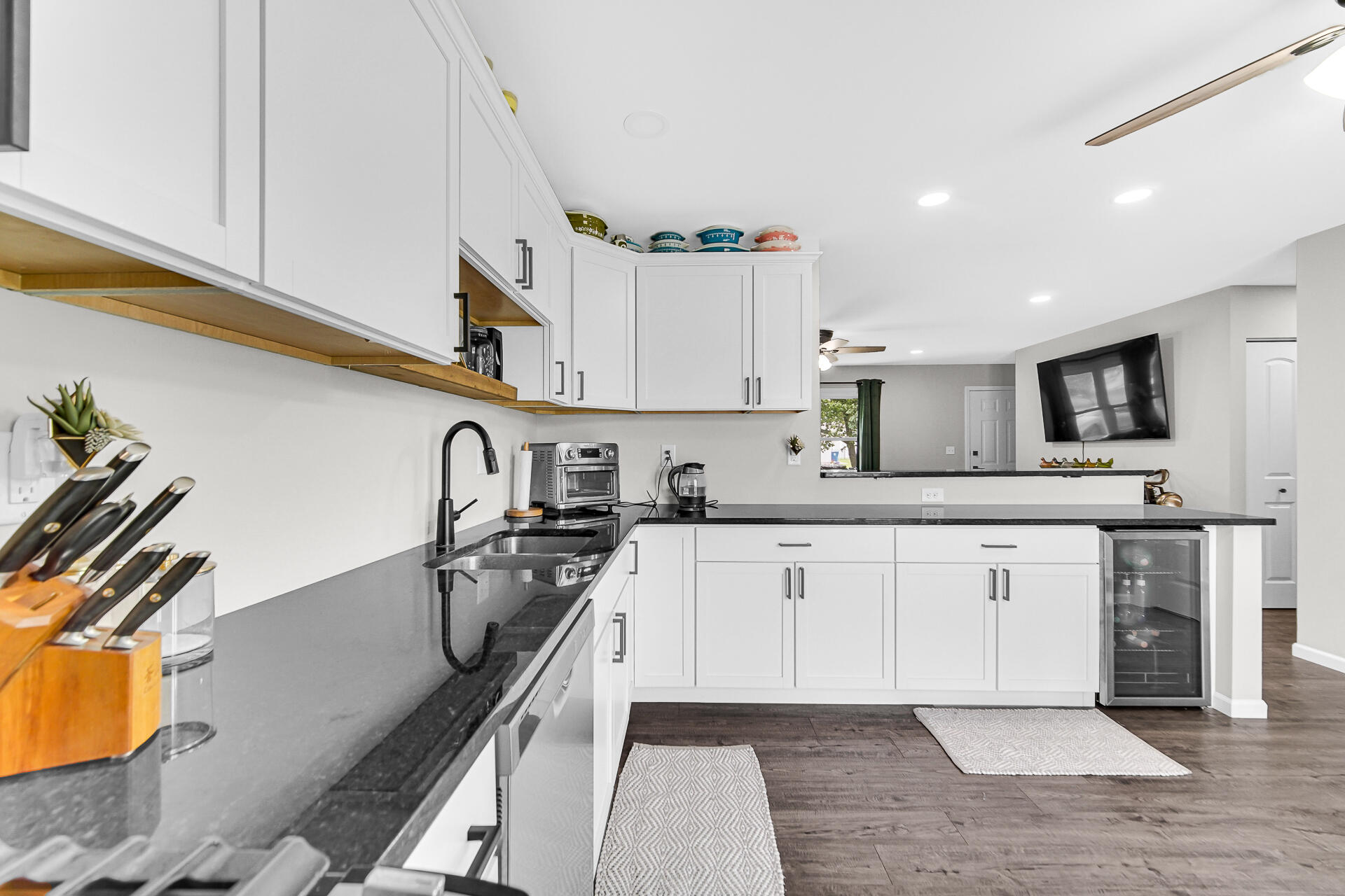 110 Beech Court Hebron, IN 46341 - Photo 8 of 18 a kitchen with stainless steel appliances granite countertop a sink and cabinets