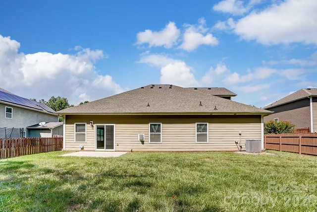 a view of a yard with a small trees