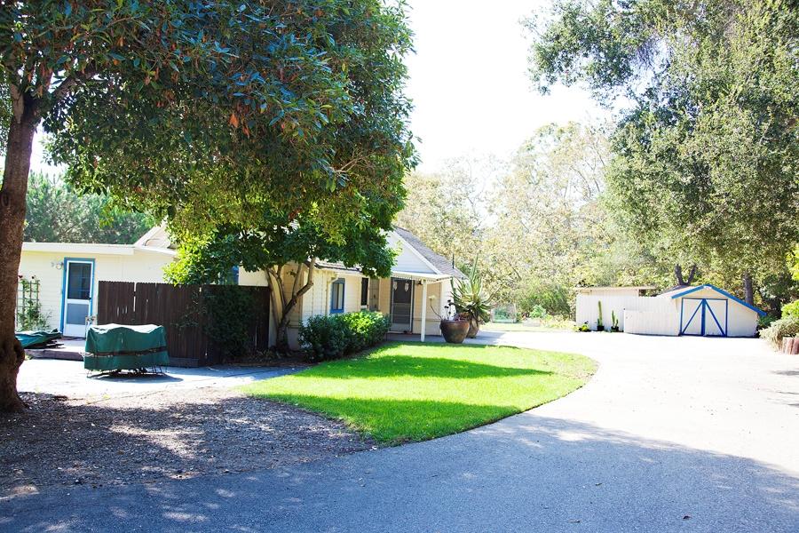 455 Toro Canyon Road Montecito, CA 93108 - Photo 16 of 17 a view of a house with a big yard and large trees