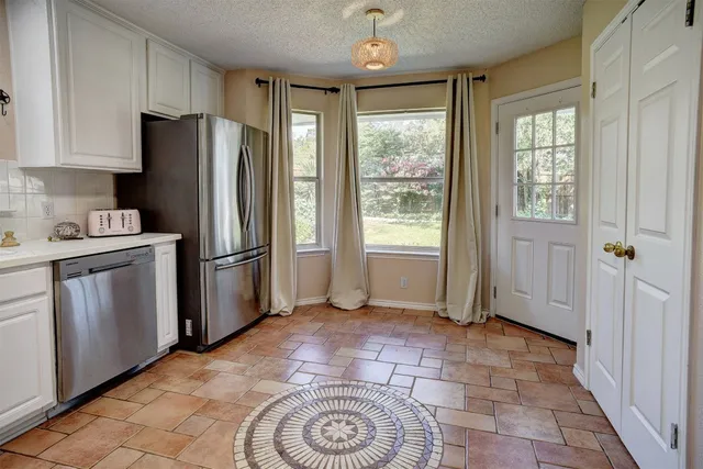 a bed room with bed and window