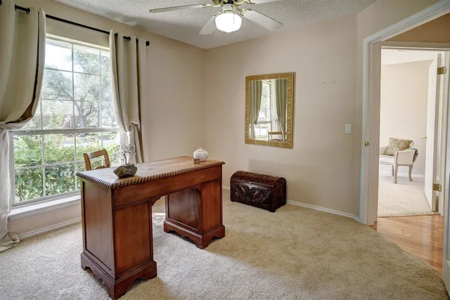 a bedroom with a bed and chair