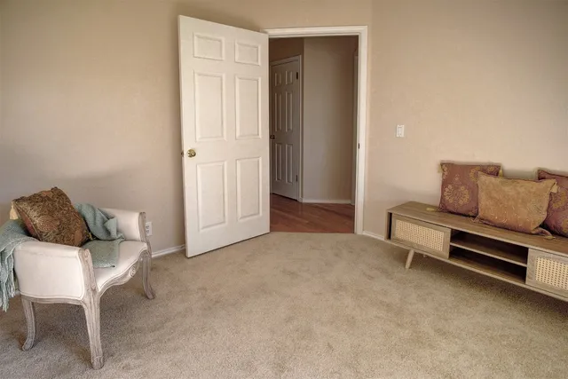 a spacious bathroom with a bathtub sink and mirror